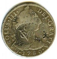 Eight reales of Charles III of 1780 with Ceylon stamp.