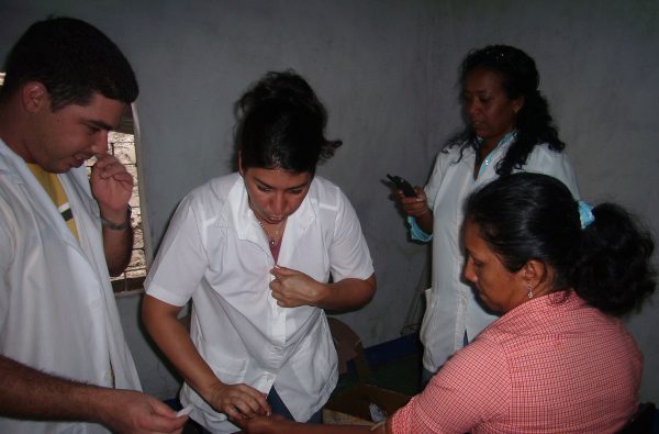 Aliocha attending to patients during her mission in Venezuela.